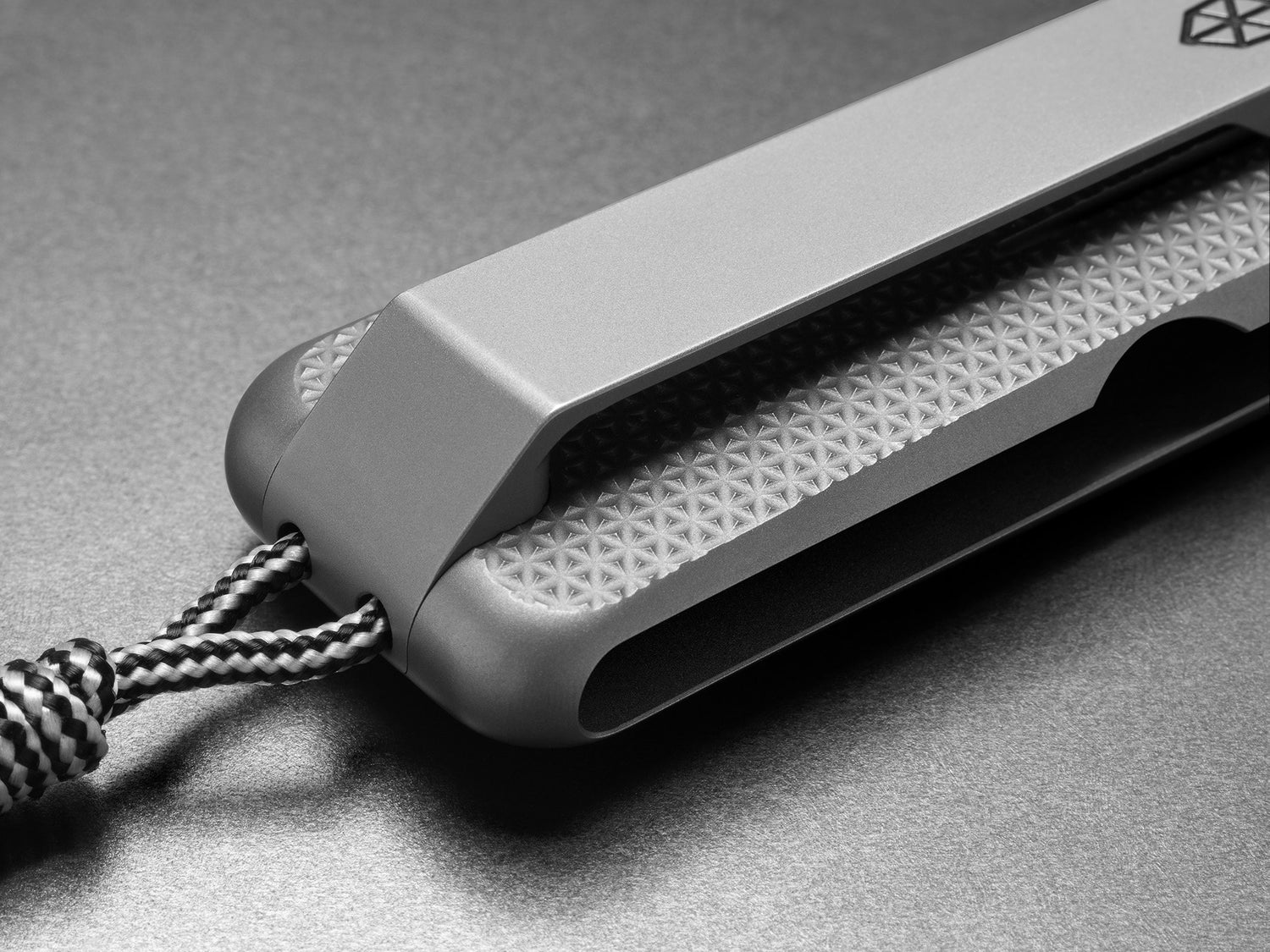 The CNC machined titanium pocket clip of The Barnes integral EDC titanium folding frame lock pocket knife.