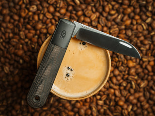 A Wayland classic Barlow EDC folding slip joint pocket knife on a cup.