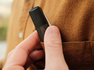 The Wayland classic Barlow EDC folding slip joint pocket knife being pulled out of a chest pocket.