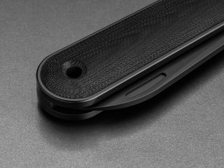 The lanyard hole of the all black Wayland classic Barlow EDC folding slip joint pocket knife.