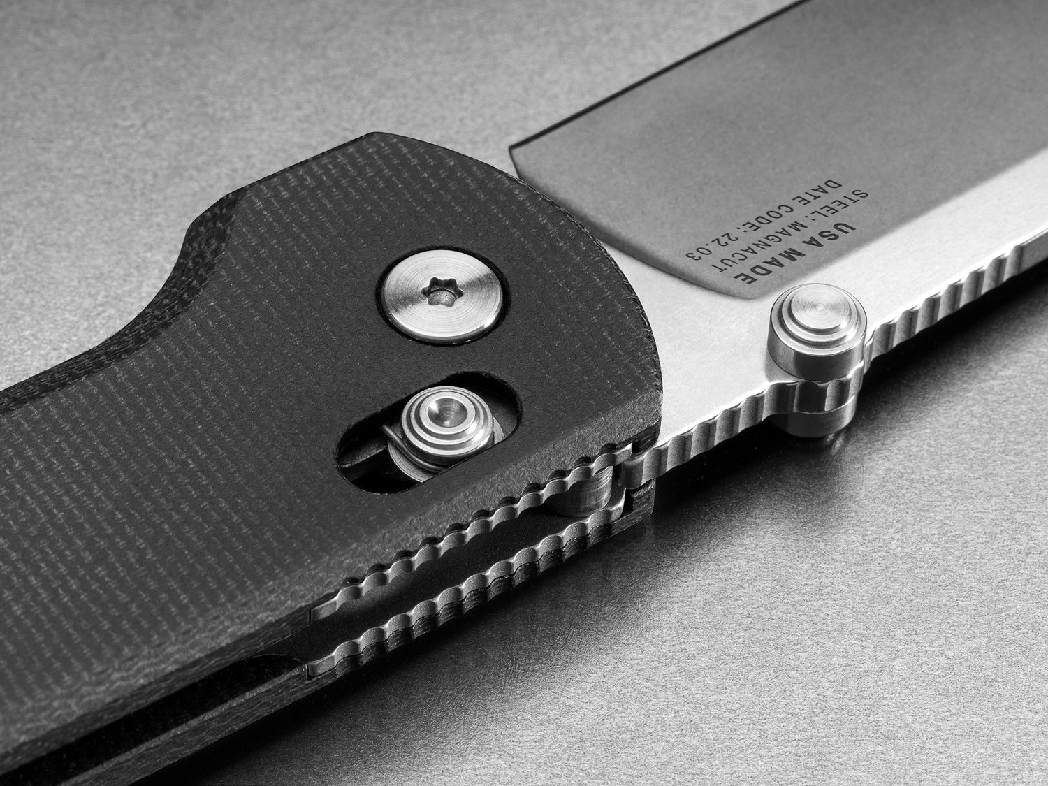 The locking mechanism of the made in the USA Kline EDC slide lock folding pocket knife in black micarta and Magnacut steel.