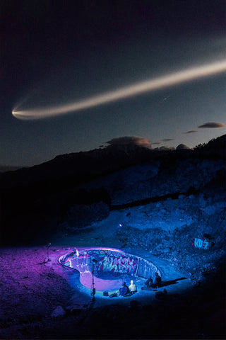 Skateboarders looking at the Space X launch at the Nude Bowl.