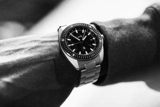 The James x Timex Automatic GMT watch on a woman's wrist.
