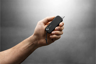 The black Palmer utility box cutter knife in hand.