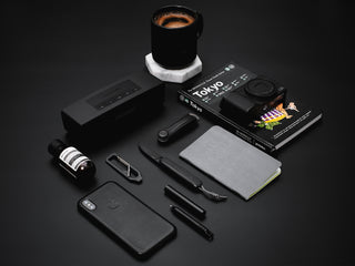 The all black Pike classic gentlemen's slip joint folding pocket knife with other everyday objects.