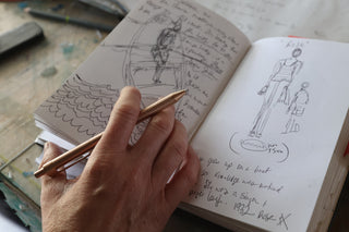 A hand drawing in a notebook with The James Brand The Burwell pen.