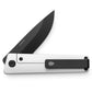 The Chapter 2 pocket knife in the bone and black colorway with the pocket clip showing.
