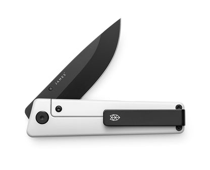 The Chapter 2 pocket knife in the bone and black colorway with the pocket clip showing.