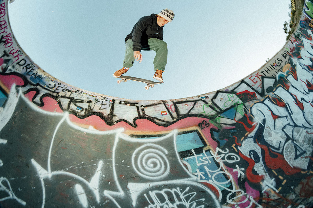 A skateboarder getting air in the Nudie Bowl.