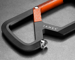 The bottle opener of the Mehlville EDC carabiner with Carryology branding.