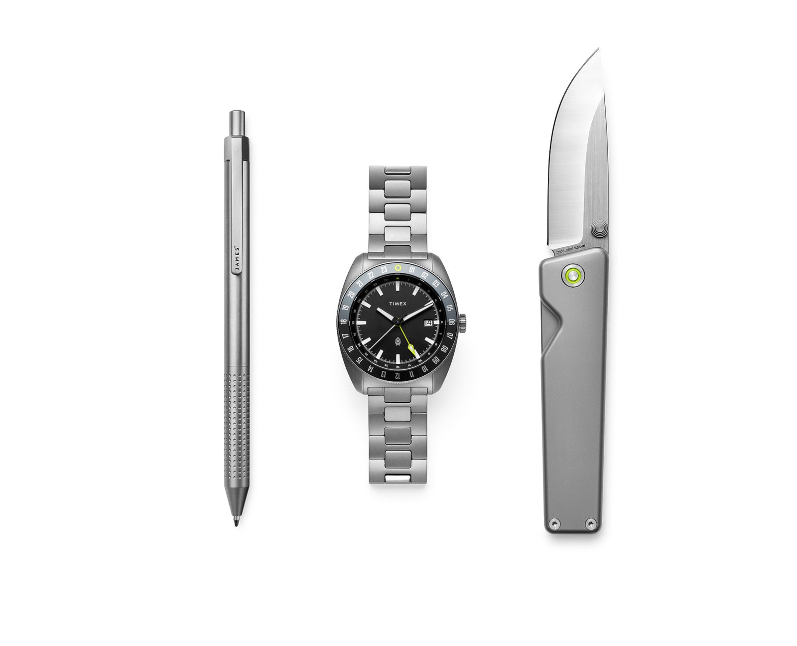 The pen, watch, and knife in the Timex × The James Brand Automatic GMT box set.