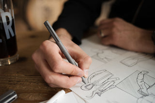 A person sketching with the Bolen twist pen.