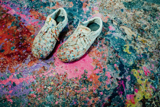 A pair of shoes covered in resin at a surfboard glassing shop in Nova Scotia.