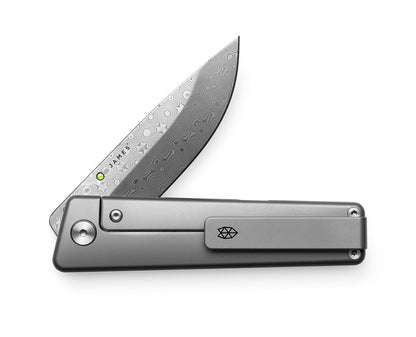 The Chapter 2 pocket knife with a Damasteel blade on the pocket clip side.