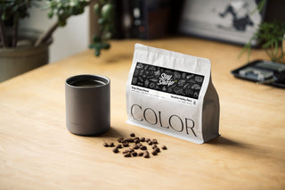 The TJB Stay Sharp coffee blend on a table with a tumbler.