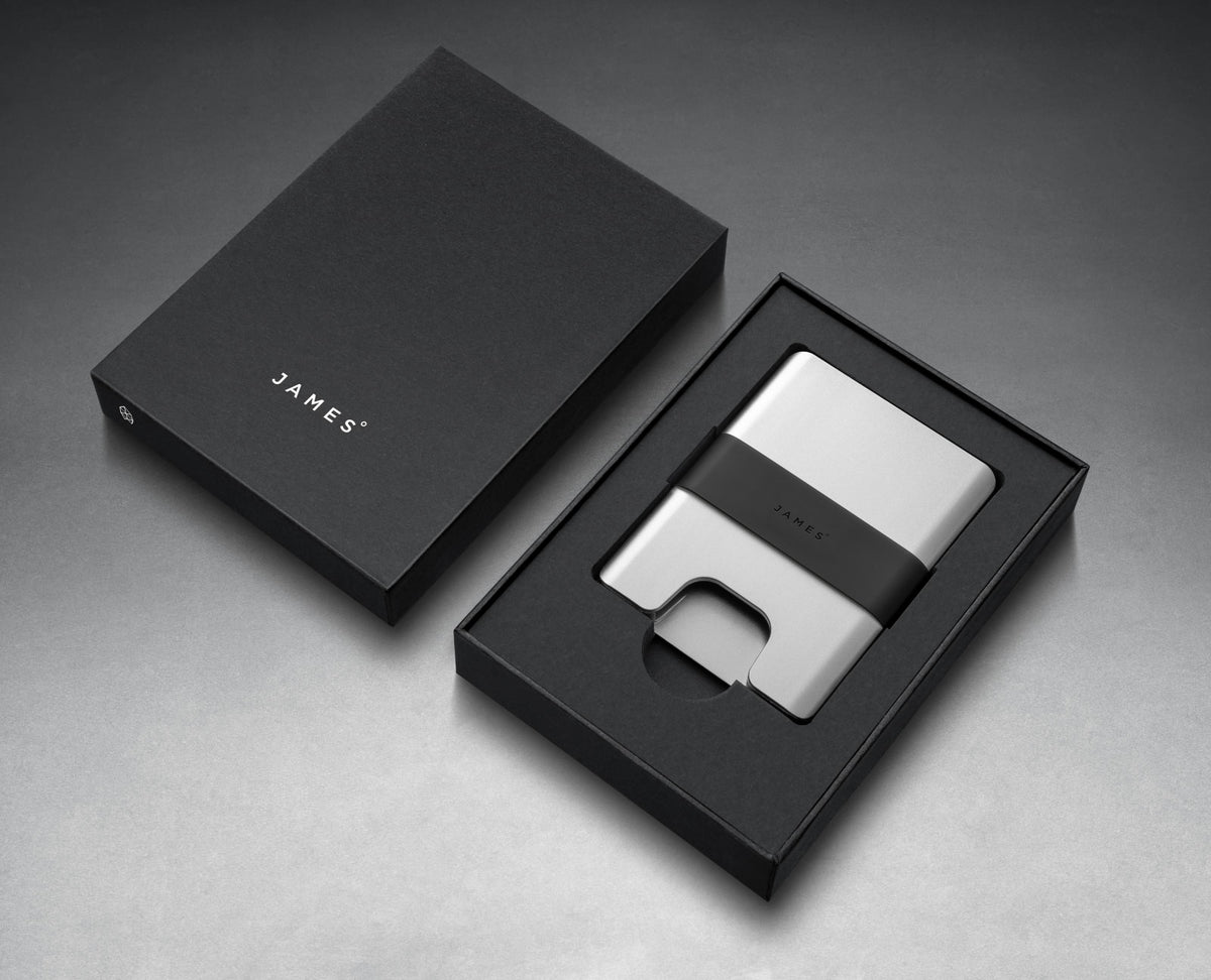 The Lowe minimalist card holder wallet in silver and black in box.