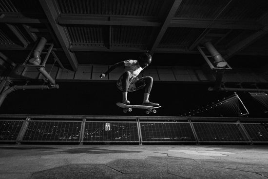 Skateboarder Beatrice Domond doing an ollie on a bridge in NYC.