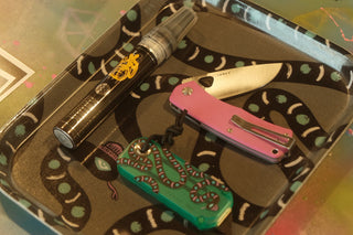 EDC items on a tray from the Mark Oblow collection.