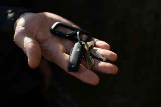 The Elko keychain knife in hand attached to keys and a carabiner.