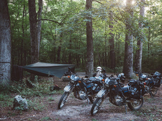 under open air motorcycles in woods