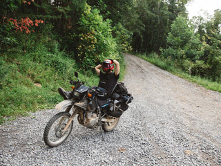under open air person relaxing on motorcycle