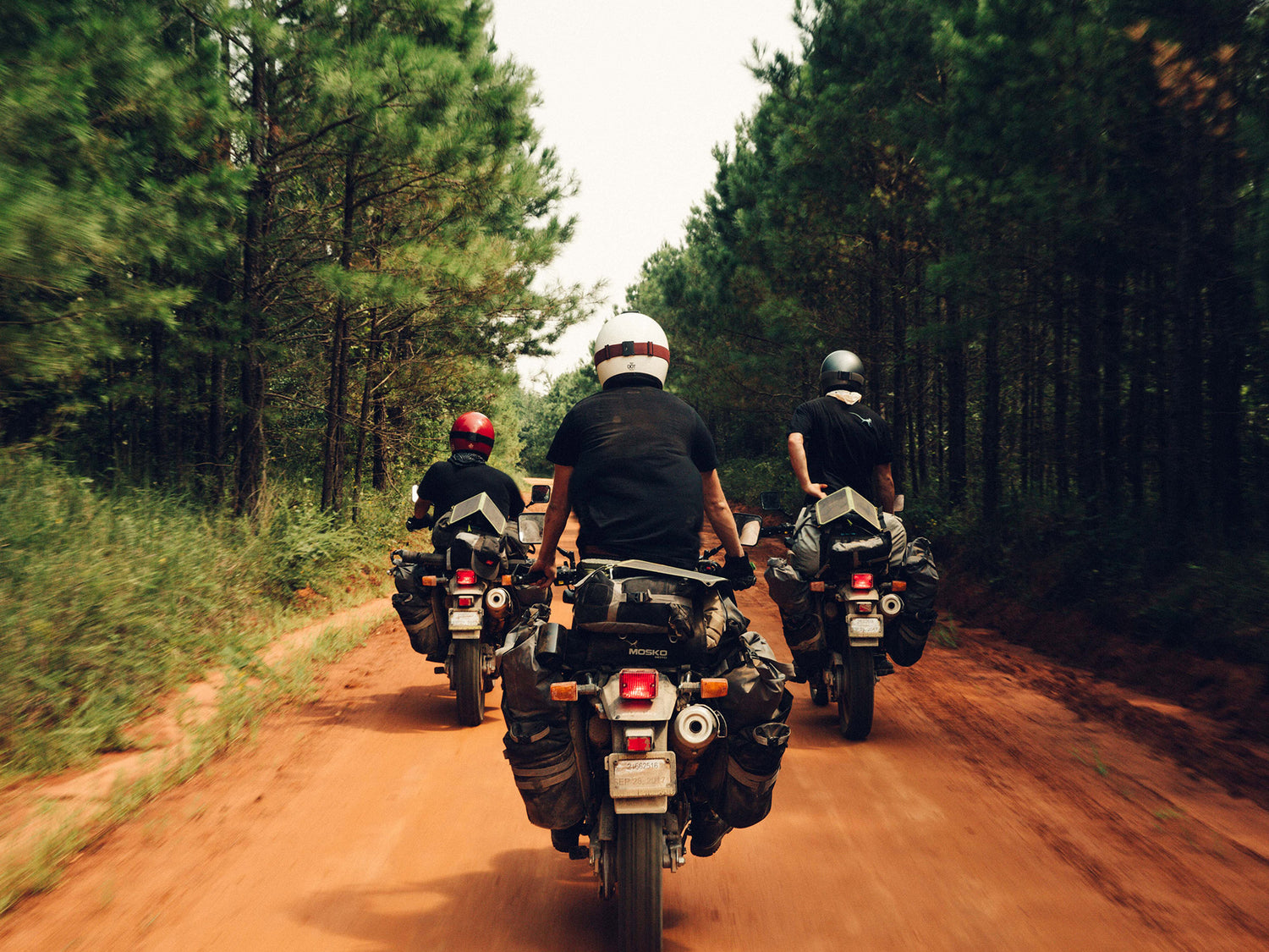 3 people on motorcycles