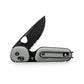 The Redstone knife with primer gray handle and serrated, black blade.